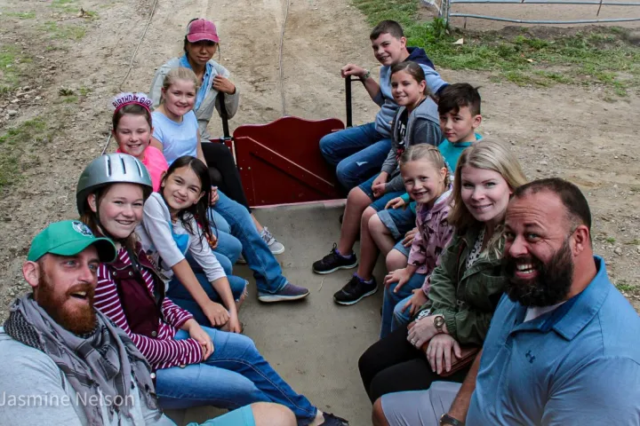 a group of people sitting on the ground