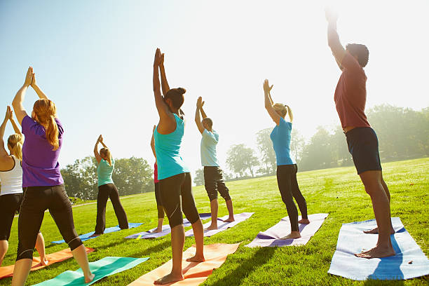 people doing outdoor yoga