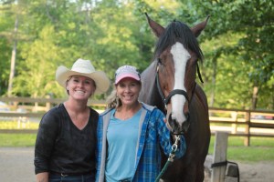 a person standing in front of a horse