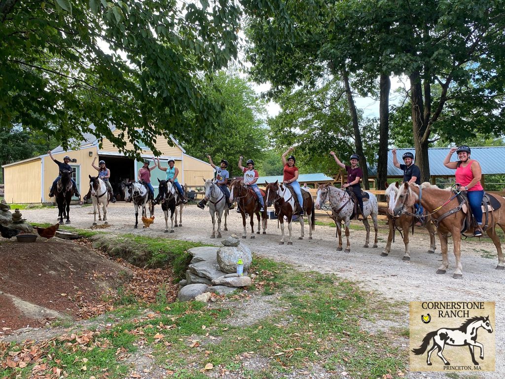A group of people riding horses