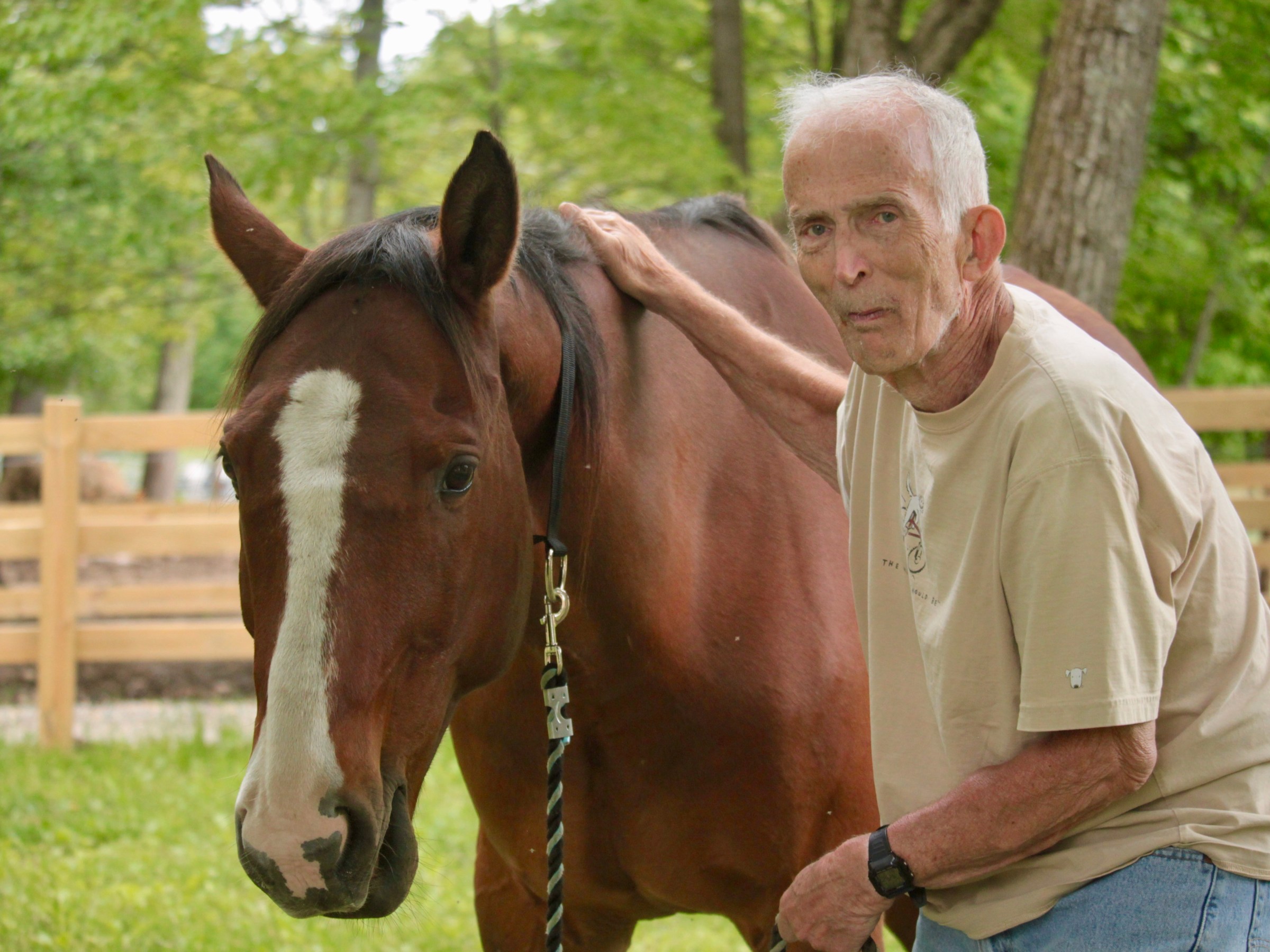 a man standing in front of a horse