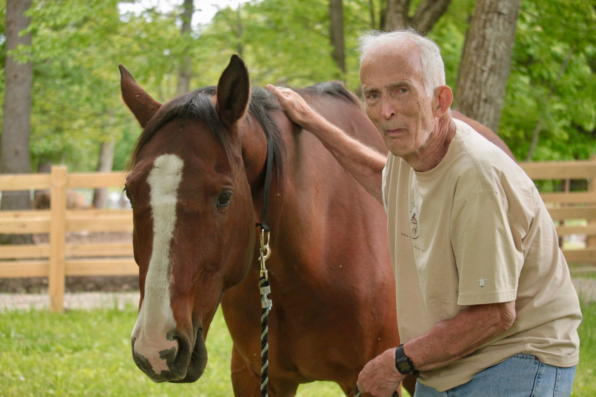 a man standing in front of a horse